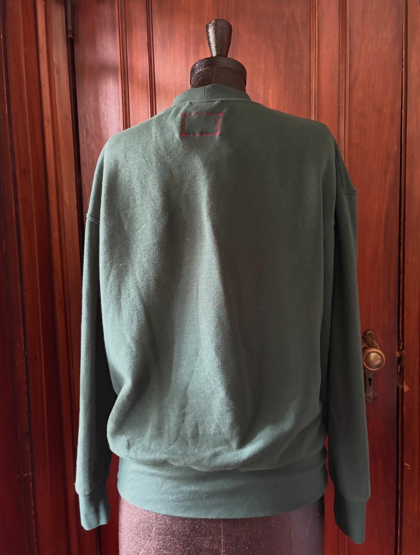 Poinsettia rug sweatshirt